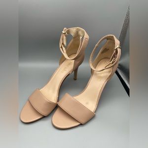 Ladies Nine West beige open toed high heeled sandals with ankle strap. Size 7.5.